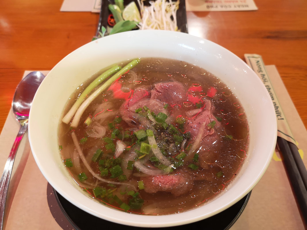 A steaming bowl of Pho 24